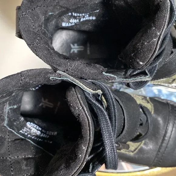 Frye women’s black leather and green canvas combat boots. Size 5 /12