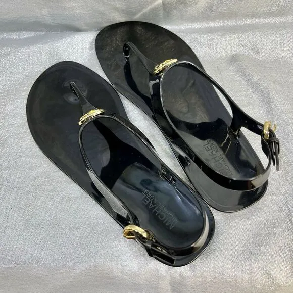 Michael Kors Mira Black Jelly Thong Sandals with Gold Lock Accent Women’s Size 9